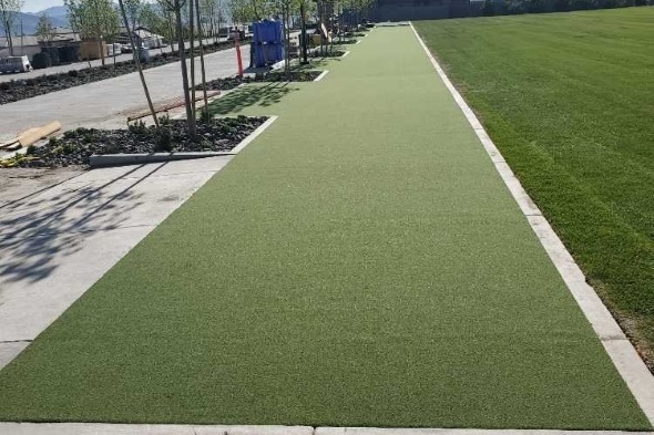 San Francisco Outdoor tee line consisting of one continuous green synthetic grass strip surrounded by trees